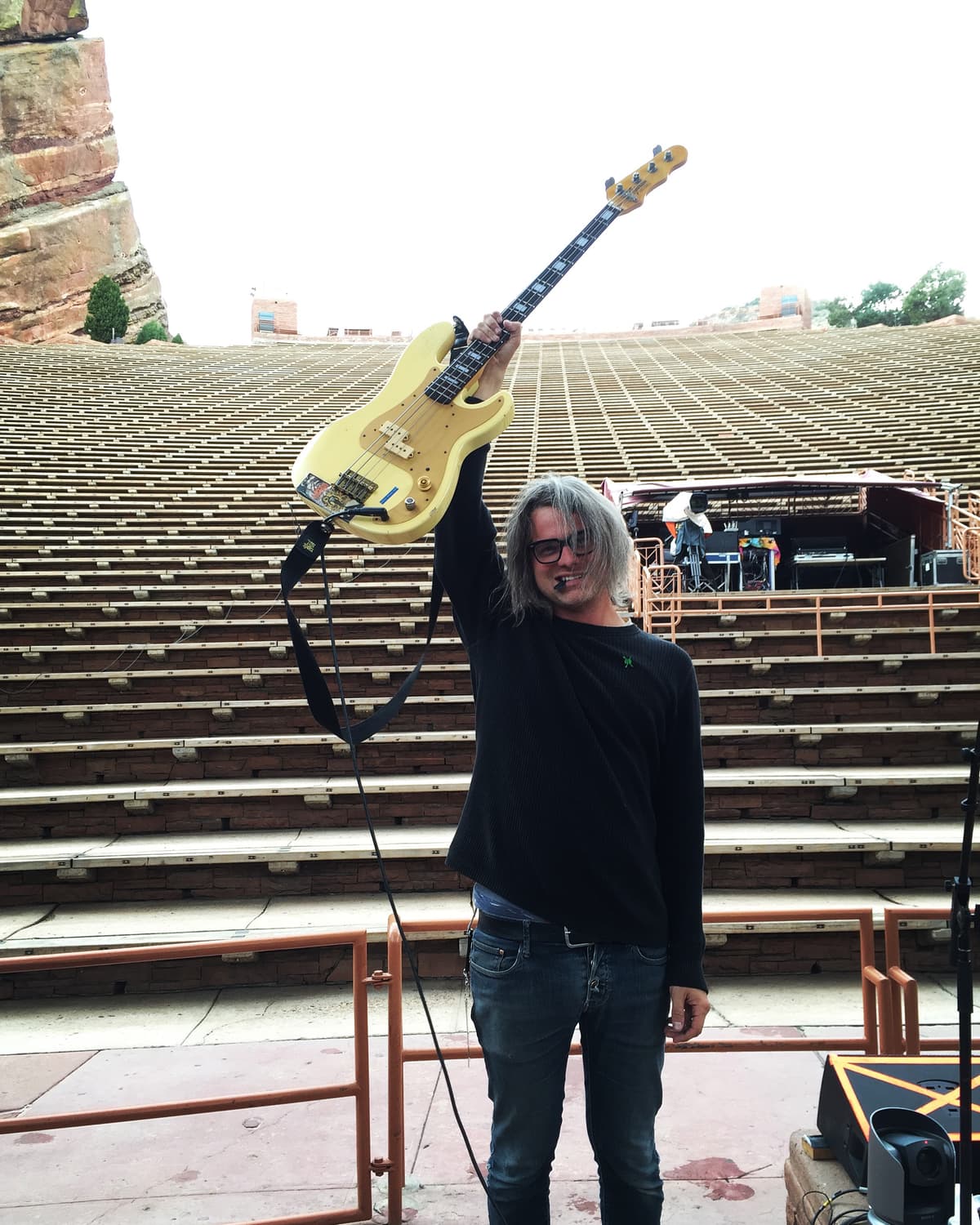 Jeremy holding bass guitar at Red Rocks